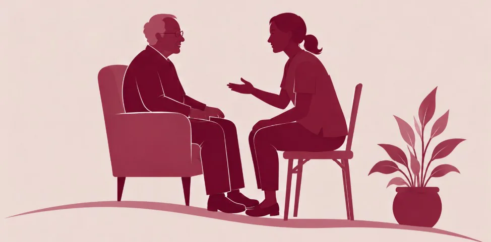 Cuidadora conversando com idoso sentado na poltrona